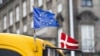 European and a Danish flags fly on a bus in Copenhagen. (File photo)