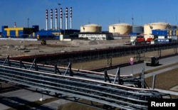 Terminalul de produse petroliere Ust-Luga, situat în localitatea Ust-Luga, la aproximativ 110 km de Sankt Petersburg, deținut de Gunvor Group. 9 aprilie 2014.