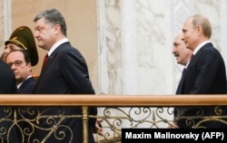 Петро Порошенко, Франсуа Олланд, Володимир Путін та Олександр Лукашенко під час переговорів у Мінську. Лютий 2015 року