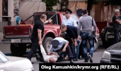 Riot police in Crimea detain a Tatar man in the Crimean capital, Simferopol. (file photo)
