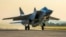 Un avion de vânătoare rusesc MiG-31 care transporta o rachetă Kinjal decolează de la baza aeriană Hemeimeem din Siria, în 2021.