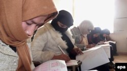 FILE: Students take an exam in Kunduz.