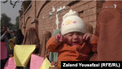 Pakistani women protest the deportation of their Afghan husbands on November 16.