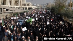 Iranian protesters chant slogans at a rally in Tehran last month.