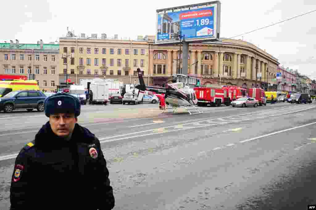 Emergency vehicles and a helicopter seen outside the entrance to St. Petersburg's Tekhnologichesky Institut subway station.&nbsp;
