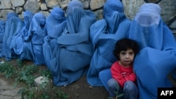 Women waiting for food aid in Herat, western Afghanistan.
