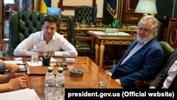 Ukrainian President Volodymyr Zelenskiy (left) meets with Ihor Kolomoyskiy in the presidential office in Kyiv in September 2019.