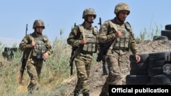 Armenia - Armenian soldiers walk through their positions along Armenia's border with Azerbaijan's Nakhichevan exclave, July 22, 2021.