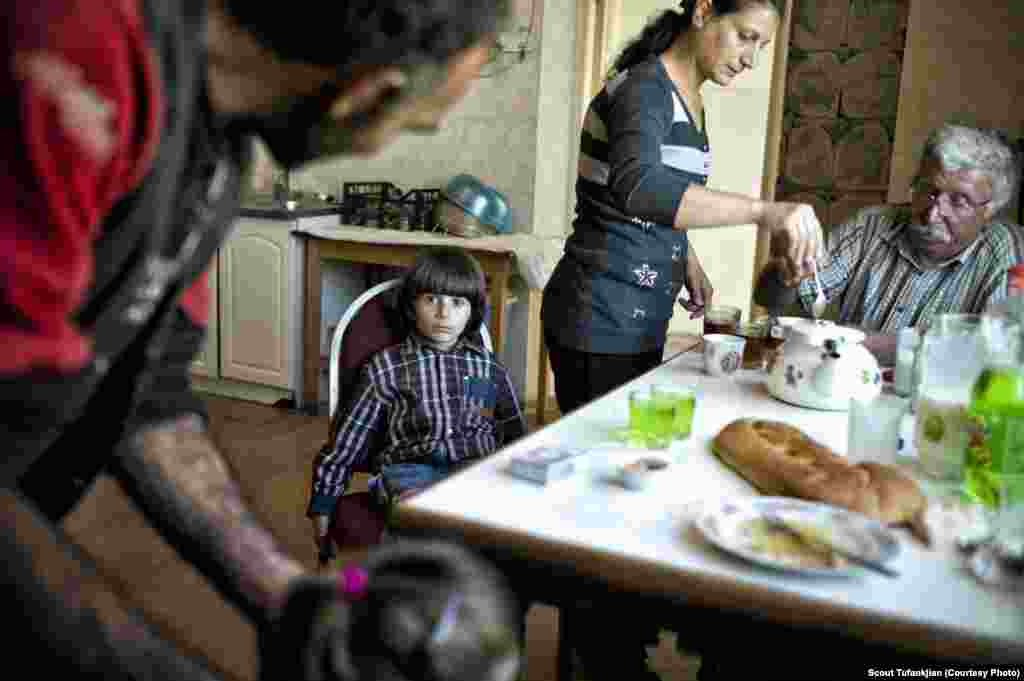 A refugee family from Syria in the town of Berdzor in Nagorno-Karabkah. Many ethnic Armenians spoke to Tufankjian of feeling comfortable everywhere; others felt permanently isolated. "I still feel like an outsider here," one Baku-born Armenian, now living in the United States, told her. "And I'm an outsider in Armenia. So to me I don't know if I'll truly be comfortable somewhere." &nbsp;