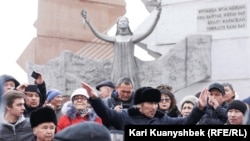 Kazakh human rights activists demonstrate in Almaty on December 16. 
