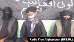 Unidentified Afghans claiming to represent a group called the Islamic Organization of Great Afghanistan, a purported militant organization they say is ready to fight for the Islamic State militant group.