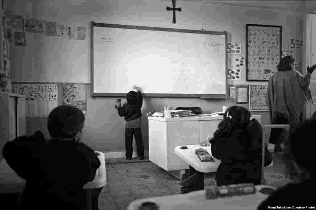 A young student practices the Armenian alphabet at the Boghossian School in Alexandria, Egypt. "I don't think Armenians have ever fully adjusted to living in the diaspora," one subject told Tufankjian. "In many ways -- financial stability, home, careers -- they have. But there's always a longing for something more...something that always pulls them to not fully be engulfed in the cities and countries they are living in now. They are always searching for something that is lost." &nbsp; &nbsp; 