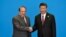 Pakistani Prime Minister Nawaz Sharif (L) shakes hands with Chinese President Xi Jinping during the welcome ceremony for the Belt and Road Forum in May.