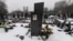 Snow covers the grave of lawyer Sergei Magnitsky with his portrait on the tomb at the Preobrazhenskoye cemetery in Moscow in December.