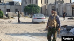 Fighters from an alliance of insurgents known as the "Army of Fatah" (Islamic Conquest) in Syria.