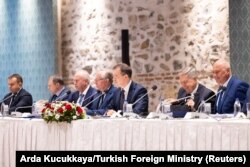 The Russian delegation, led by presidential adviser Vladimir Medinsky (center), sits across from Ukrainian officials (not pictured) in Istanbul on May 16.