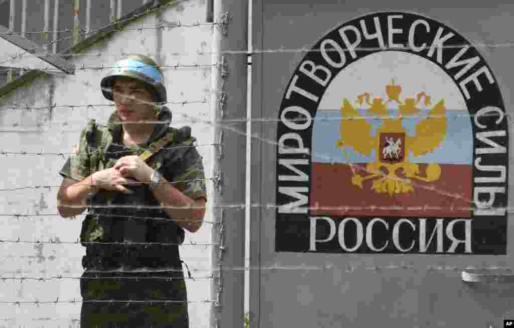 A Russian peacekeeper guards a checkpoint at the Inguri River in Abkhazia on August 14, 2008. In Georgia's other breakaway region of Abkhazia, Russian peacekeepers had been stationed since 1994 to stop military clashes and ethnic cleansing that began in 1992, along with unarmed UN observers. This force fought sporadically with local Georgian militants as well as militants from the neighboring North Caucasus. As fighting broke out in South Ossetia in August 2008, Russian and Abkhaz forces attacked Georgian troops in the Kodori Gorge and then moved into Georgia.