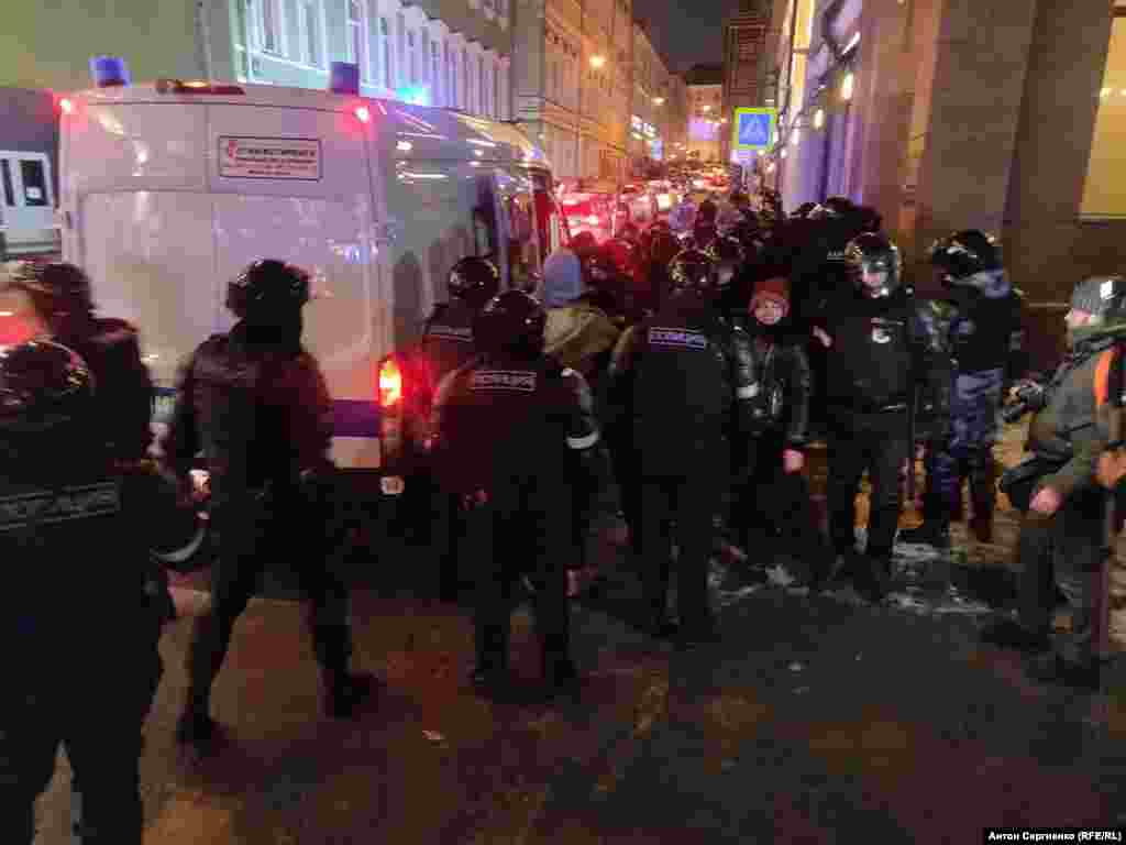 Detainees are taken away in Moscow.