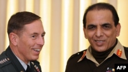 Pakistani Army chief General Ashfaq Kayani (right) meets with U.S. General David Petraeus in January. Is Kayani tempted to step in for the beleaguered government?