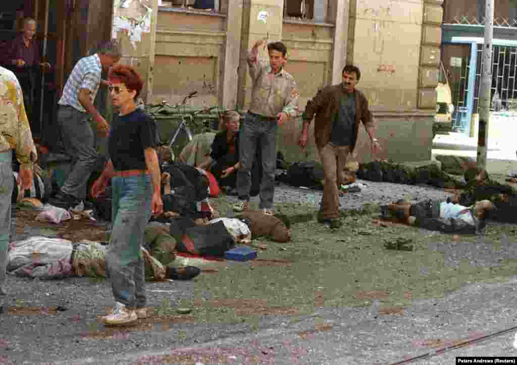 The scene after mortars slammed into the crowded Markale marketplace in central Sarajevo on August 28, 1995. Forty-three people died in this, the second of two deliberate attacks on the market that came to be known as the Markale Massacres. The August shelling was among the reasons cited for NATO's bombing of Bosnian Serb forces, which started later the same month.