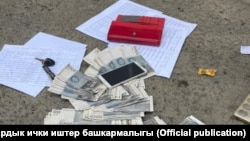 Милициянын жеринен тарткан сүрөтү. 