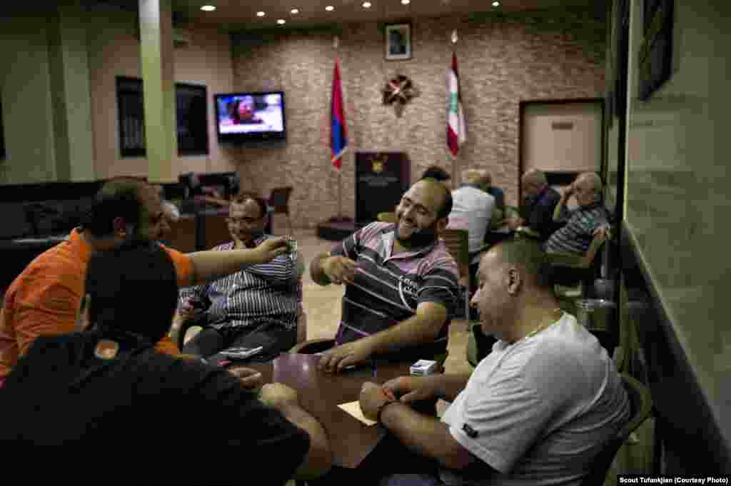 Men playing cards at the headquarters of Dashnak, the traditional Armenian political party, in the East Beirut neighborhood of Bourj Hammoud. Some 150,000 Armenians currently live in Lebanon, and are considered a powerful minority. "I feel like I am part of a big dysfunctional family that will always be there if I need them," one Lebanese-Armenian says.&nbsp; &nbsp;
