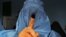 Afghanistan -- An Afghan woman shows her inked finger after voting at a polling station in the northwestern city of Herat, April 5, 2014