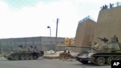 A mobile-phone photo purporting to be of Syrian army tanks in the eastern Syrian province of Deir el-Zour, provided by Shaam News Network.