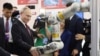 Russian President Vladimir Putin visits an exhibition at the Harbin Institute of Technology in Harbin as part of a 2024 state visit to China. 