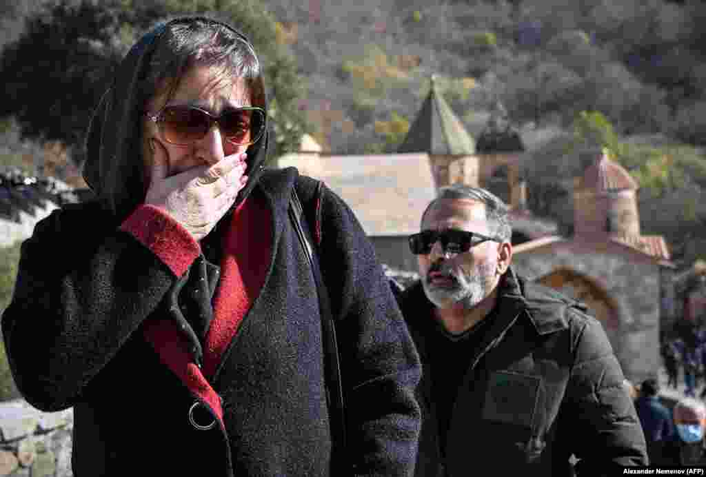A woman cries as she leaves the grounds of the Dadivank monastery on November 12.