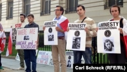 Protesters near the Belarusian Embassy in Washington marked the 15th anniversary of the disappearance of two critics of the regime of Belarusian President Alyaksandr Lukashenka.