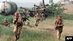 Russia -- Russian special forces enter a Chechen village. May 1996