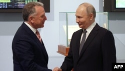 Russian President Vladimir Putin shakes hands with US President Donald Trump's envoy Steve Witkoff during a meeting in Saint Petersburg on April 11.