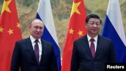 Россия президенти Владимир Путин ва Хитой раиси Си Цзиньпин.