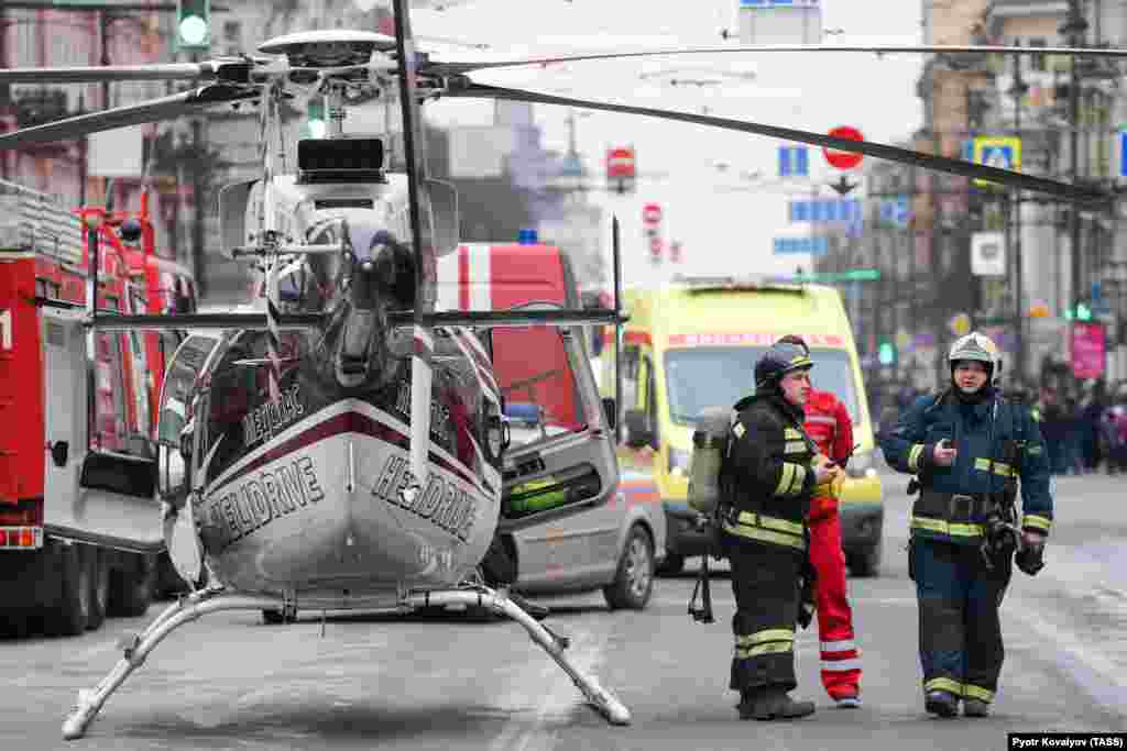 Emergency vehicles and a helicopter are seen outside the St. Petersburg Metro's Tekhnologichesky Institut station.