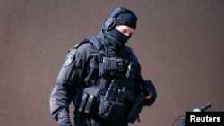 یک مامور پلیس استرالیا در جریان گروگان‌گیری در میدان مارتین استرالیا