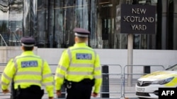 British police officers patrol in front of New Scotland Yard, central London. (file photo)