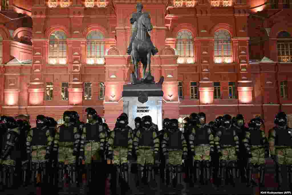Security forces stand guard in front of a monument to Soviet Marshal Georgy Zhukov outside Red Square in Moscow.