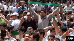 Iranian opposition supporters protest in Tehran in July.