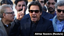 Imran Khan, chairman of the Pakistan Tehreek-e-Insaf (PTI) political party, addresses the media after the Supreme Court dismissed a petition to disqualify him from parliament for not declaring assets on December 15.