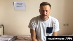 Jailed Russian opposition leader Aleksei Navalny sits on a hospital bed in Moscow on July 29. 