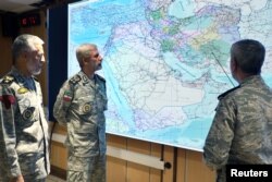 Iranian Army commander-in-chief Amir Hatami (center) attends a meeting in the military's War Command Room at an undisclosed location in Iran.