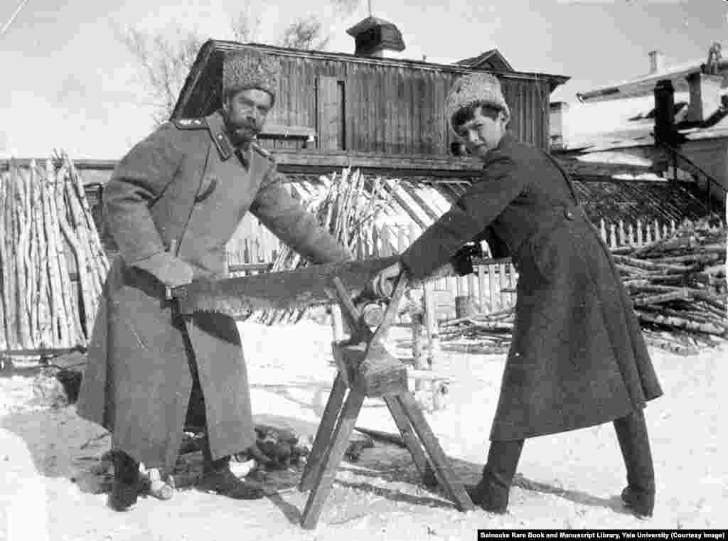 Tsar Nicholas II and his son Aleksei sawing wood while in captivity. They were killed a few months later. The diary of a senior Soviet leader recalls that Vladimir Lenin made the decision to have the Romanovs executed, after concluding "we shouldn't leave the [anti-Bolshevik forces] a living emblem to rally around, especially under the present difficult circumstances."