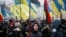 People attend a rally in front of the Ukrainian parliament on January 16, calling for lawmakers to recognize Russia as an aggressor state and implement other legislative changes concerning the occupied parts of eastern Ukraine. 