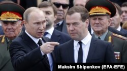 Russian President Vladimir Putin (left) to former Prime Minister Dmitry Medvedev: "I'm tired, you're going." 