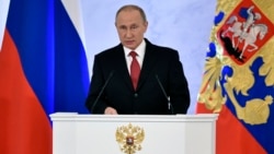 Russian President Vladimir Putin gives his annual address to a joint session of parliament and the government at the Kremlin on December 1.
