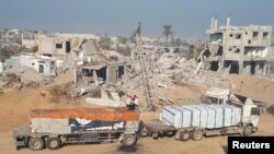 სატვირთო მანქანებმა დახმარება მიიტანეს რაფაჰში, სამხრეთ ღაზაში. 4 თებერვალი, 2025. REUTERS/Hussam Al-Masri