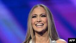 U.S. singer Jennifer Lopez speaks onstage as she hosts the 51st American Music Awards at the Fontainebleau in Las Vegas, Nevada on May 26, 2025.