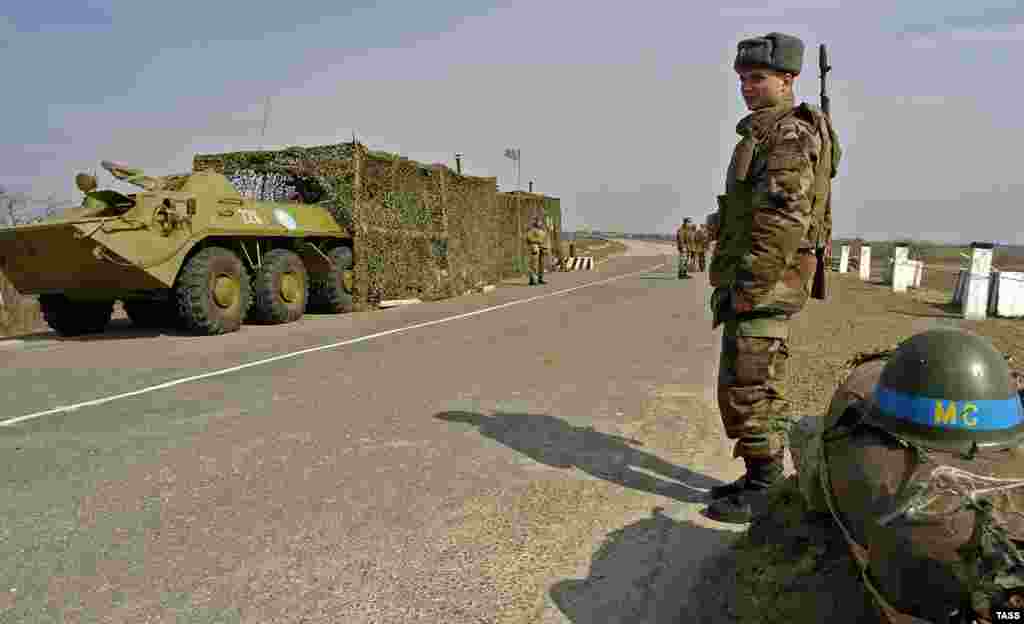 Russian peacekeepers guard a checkpoint in Moldova's breakaway Transdniester region in January 2012. A force comprising troops from Moldova, Russia, and the breakaway region of Transdniester was set up following a truce in 1992 to stop fighting between Moldovan forces and Transdniestrian forces backed by Cossacks and Russian troops stationed in the enclave. The peace has held since then, but Transdniester's independence is not recognized by any country. Russia has refused repeated demands by the Moldovan government to facilitate the replacement of Russian troops with internationally recognized peacekeepers and maintains strong influence in Moldova as a whole.