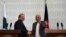 Pakistani Prime Minster Nawaz Sharif (L) shakes hands with Afghan President Ashraf Ghani during a press conference at the Presidential palace in Kabul on May 12.